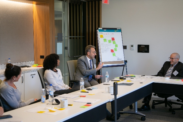 Summit participants at a conference table